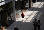 People walk through the Lloyd Center.