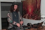 DJ Cromulon plays music at a group psilocybin session at Shrooms Cafe in Medford on Nov. 8, 2024.