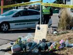 Flowers and a sign reading "love over hate" lay near an LGBTQ nightclub in Colorado Springs, Colo., on Sunday, where a shooting occurred late Saturday night.