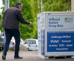 Jeremy Haug drops a ballot into the drop box at the Hillsdale Library in Hillsdale, May 21, 2024.