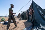 U.S. service members set up tents in at Naval Station Guantanamo Bay in support of the removal operations led by DHS at Naval Station Guantanamo Bay.