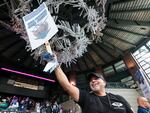 Manny Briones, an iron machinist from Seattle, welcomes members and supporters of the International Association of Machinists and Aerospace Worker Union District 751 for an early strike-sanction vote at T-Mobile Park in Seattle on July 17.