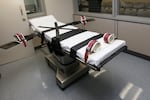 FILE - This photo shows the gurney in the execution chamber at the Oklahoma State Penitentiary in McAlester, Okla., on Oct. 9, 2014. A scheduled execution in Alabama that was called off Thursday, Nov. 17, 2022, after prison officials could not find a suitable vein to inject the lethal drugs into is the latest in a long history of problems with lethal injections since Texas became the first state to use the execution method in 1982, including delays in finding usable veins. (AP Photo/Sue Ogrocki, File)