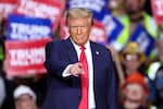 Former President and Republican presidential candidate Donald Trump gestures during a campaign rally in Pittsburgh, Pa., on Monday, the night before Election Day.