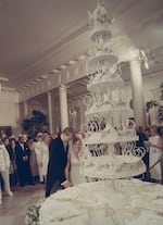 Tricia Nixon cuts into her wedding cake with her husband, Edward Cox, on June 12, 1971.