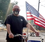 Fred Ingersoll, 72, rides his bike home from Walmart in Island City, Ore., on July 21, 2026, despite a DEQ air quality advisory.