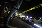 FILE: Protesters stand behind a police line in Hazel Dell, Washington, in 2020 after a fatal shooting by the Clark County Sheriff's Office.