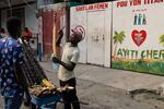 A vendor sells sugarcane next to the entrance of the Doctors Without Borders (MSF) clinic in Port-au-Prince, Haiti, Wednesday, Oct. 15, 2025, after the organization announced the facility’s closure due to ongoing violence.