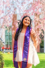 Linfield senior Karina Alcantara Guerrero poses for a graduation photo. Alcantara Guerrero is currently a peer mentor and student coordinator for the First Scholars program.