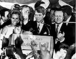 FILE-- In this June 5, 1968 file photograph, U.S. Sen. Robert F. Kennedy, D-NY, speaks to campaign workers, June 5, 1968, as his wife Ethel, left, and California campaign manager and speaker of the California Assembly, Jesse Unruh, look on, at the Ambassador Hotel in Los Angeles. After making a short speech, Kennedy was shot in an adjacent room.