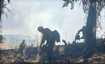 Firefighters continue their work of removing fuels and mopping up wherever possible Wednesday, Oct. 15, 2024, building containment lines above Cougar Ridge on the northwest area at the Rail Ridge Fire in the Ochoco National Forest.