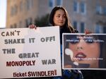 Amy Edwards rallied against Ticketmaster with Swift-themed signs outside the Capitol on Tuesday.