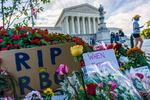 People gather at the Supreme Court on the morning after the death of Justice Ruth Bader Ginsburg, 87, Saturday, Sept. 19, 2020, in Washington, D.C..