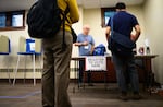 ST. PAUL, MINNESOTA - AUGUST 11: Voters register at a polling place in Merriam Park Library on August 11, 2026 in St. Paul, Minnesota. Minnesota Lt. Gov. Peggy Flanagan and Rep. Angie Craig (D-MN) are vying for Minnesota's Democratic nomination for U.S. Senate in today's primary election.