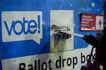 A person places their ballot in a drop box on Election Day, Tuesday, Nov. 5, 2024, in Seattle.
