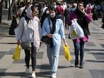Women shop in the old main bazaar of Tehran, Iran, in October 2022. Iranian police have announced a new campaign to force women to wear the Islamic headscarf.