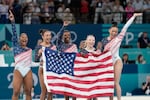 Members of Team USA celebrate after winning the gold medal in the women's artistic gymnastics team finals round at Bercy Arena at the 2024 Summer Olympics, Tuesday, July 30, 2024, in Paris, France.
