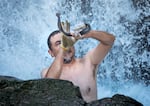 Ralph Lampman, who is Lamprey Project Lead for Yakama Nation Fisheries, holds up a lamprey harvested beneath a waterfall at Willamette Falls, near Oregon City, Ore., July 12, 2024.