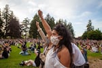 Attendees of the vigil for George Floyd raise their fists during a Black Riders Liberation Party led chant of "Power to the People" in Peninsula Park in Portland, Ore., Friday, May 29, 2020.