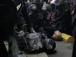 Portland police officers make arrests during the 113th night of demonstrations for racial justice in the city.
