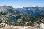 A view of alpine lakes and glacier-carved valleys as seen from the top of Eagle Cap in northeastern Oregon in August 2023. Hen Party women would revel in the epic glory of scenes like this.