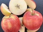 The new Washington State University apple, currently known as WA 64, is smaller than the Cosmic Crisp. It has a lighter orange and pink blush exterior.