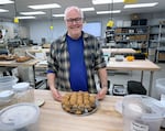 Andrew Ross stands in the OSU research bakery with a tray of cookies and muffins made with naked barley on June 4, 2024. Ross is a professor of cereal chemistry at OSU and uses the research bakery to develop recipes with naked barley.
