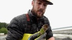 Caleb Davis of Baywater Shellfish Farm examines a "good lookin' oyster."