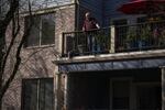 Bill Bolstad stands on his balcony at Hawthorne Gardens, the assisted living facility where he lives in Portland, Ore., on March 20, 2020. Homes across the state are restricting visitors in an attempt to limit residents’ chances of coming in contact with the coronavirus.