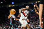 Portland Trail Blazers forward Jerami Grant passes behind his back in the second half of an NBA basketball game against the Memphis Grizzlies Friday, Feb. 6, 2026, in Portland, Ore.