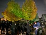 Protesters gathered outside the home of Portland City Commissioner Dan Ryan on Tuesday night, urging him to support cuts to the Portland Police Bureau budget.