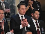 Tesla CEO Elon Musk applauds as Israeli Prime Minister Benjamin Netanyahu speaks to a joint meeting of Congress at the U.S. Capitol on Wednesday. Musk has endorsed former President Donald Trump's campaign — but he says he isn't donating $45 million each month to the cause.