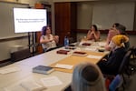 Avery Barron, left, leads a discussion on the Book of Deuteronomy, the fifth and final book of the Torah, at Congregation Shir Tikvah’s weekly queer Torah study group at Eastside Jewish Commons in Portland, Ore., on Aug. 18, 2026.