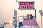 The sun sets through wildfire smoke at the Oregon State Fair in Salem.