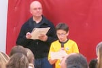 West Sylvan Middle School sixth grader Ethan Rodriguez addresses a Nov. 16 meeting on proposed school changes, as Portland Public Schools board member Paul Anthony looks on.