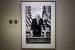 A photograph of President Trump and a short plaque next to it are on display at the Smithsonian's National Portrait Gallery's "American Presidents" exhibit on Sunday.
