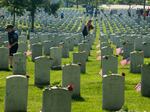 Every year, members from every branch of the military participate in placing flags on more than 400,000 tombstones on the cemetery grounds.