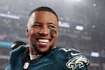 Saquon Barkley #26 of the Philadelphia Eagles smiles during the NFC Divisional Playoff game against the Los Angeles Rams at Lincoln Financial Field on January 19, 2025 in Philadelphia, Pennsylvania.
