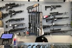 FILE - Firearms are displayed at a gun shop in Salem, Ore., Feb. 19, 2021.