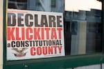 A sign in support of Klickitat County adopting a constitutional county resolution rests in the window of a storefront in Goldendale, Wash., in 2023. The controversial resolution was submitted for consideration by Klickitat County Sheriff Bob Songer in 2022.