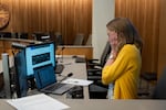 Whetstone reacts as she receives a notice that the Zoom application on her computer must update before the City Council meeting at Portland City Hall in Portland, Ore., on July 8, 2026.