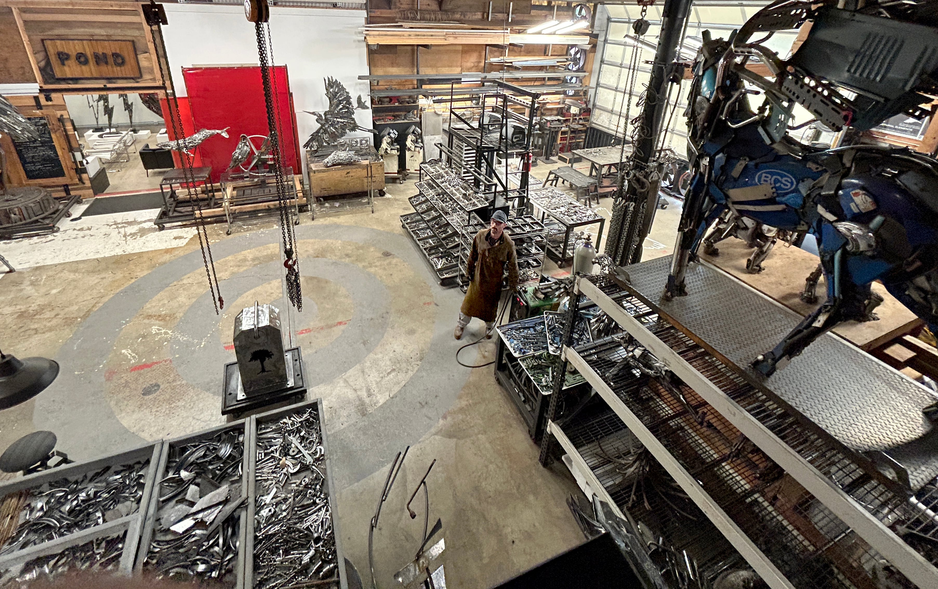 Travis Pond stands inside his studio in Oregon City.