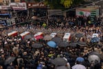 Residents and relatives mourn the loss of seven members of the Berjawi family, on Feb. 17 in Nabatieh.