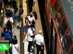 People enters a public transport train at main train station in Berlin, Germany, Sunday, June 19, 2022.