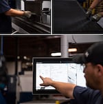 Bryan Roloff navigates a computer system to set up a machine that precisely bends steel in Marlin Steel's Baltimore factory.