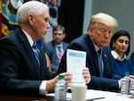 President Donald Trump listens as Vice President Mike Pence speaks during a meeting on the coronavirus in the Roosevelt Room of the White House on March 10, 2020.