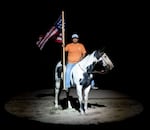 Happy Canyon Night Show participant Aaron Hines and his paint horse Dancer present the flag during the national anthem at a rehearsal on Sept. 10, 2026, at the Happy Canyon Arena in Pendleton, Ore.