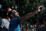 Eclipse watchers take selfies at the Tom McCall Waterfront Park.