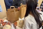 The ABCD Allston/Brighton Neighborhood Opportunity Center in Boston gave away turkeys for Thanksgiving this year. Some recipients say they are so stretched on food, they might need to eat theirs before the holiday.