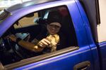 Adam Truitt, 37, owner and founder of Pest Fighter, pets his dog Olive before attempting to capture or kill rats in an alley in Seattle's University District on Tuesday October 4, 2016.